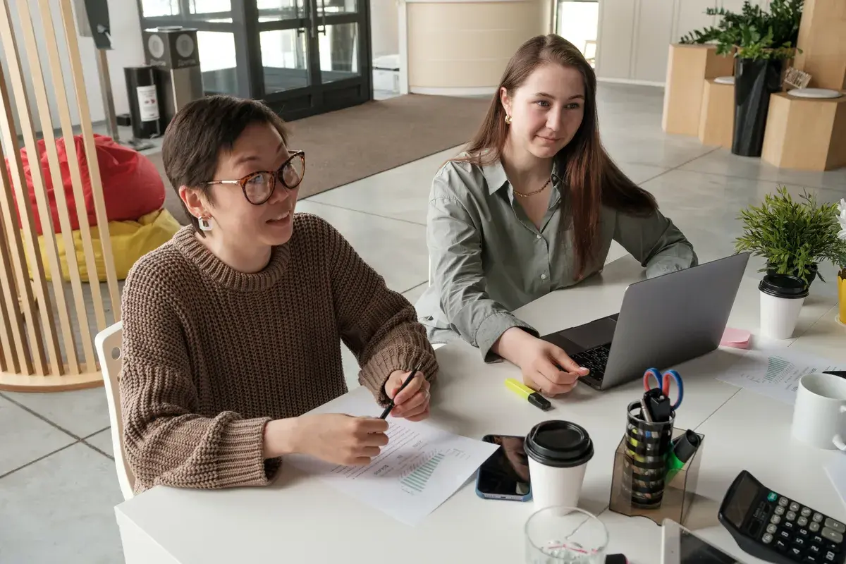Mortgage broker and agent talking in an office