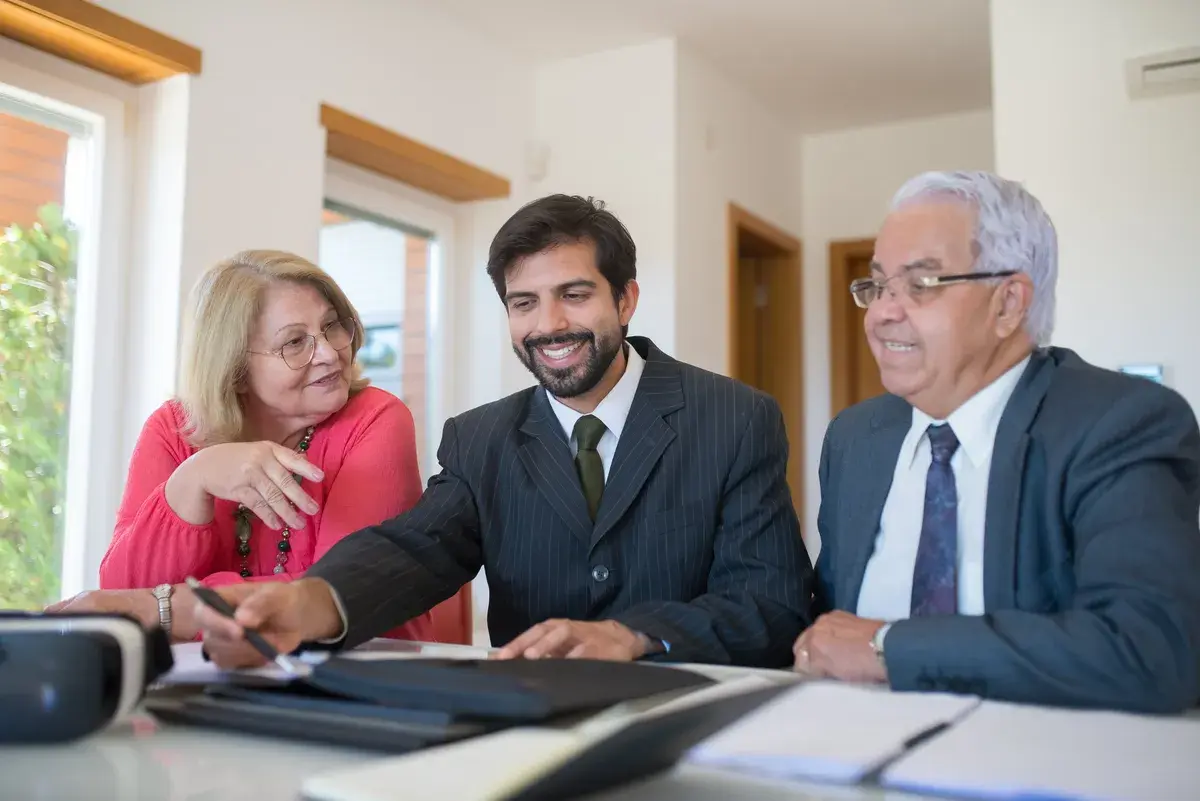 Couple laughing with their mortgage broker