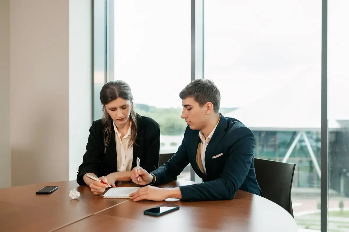 Woman signing contract with a professional mortgage broker